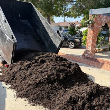 Landscaping delivery equipment at work